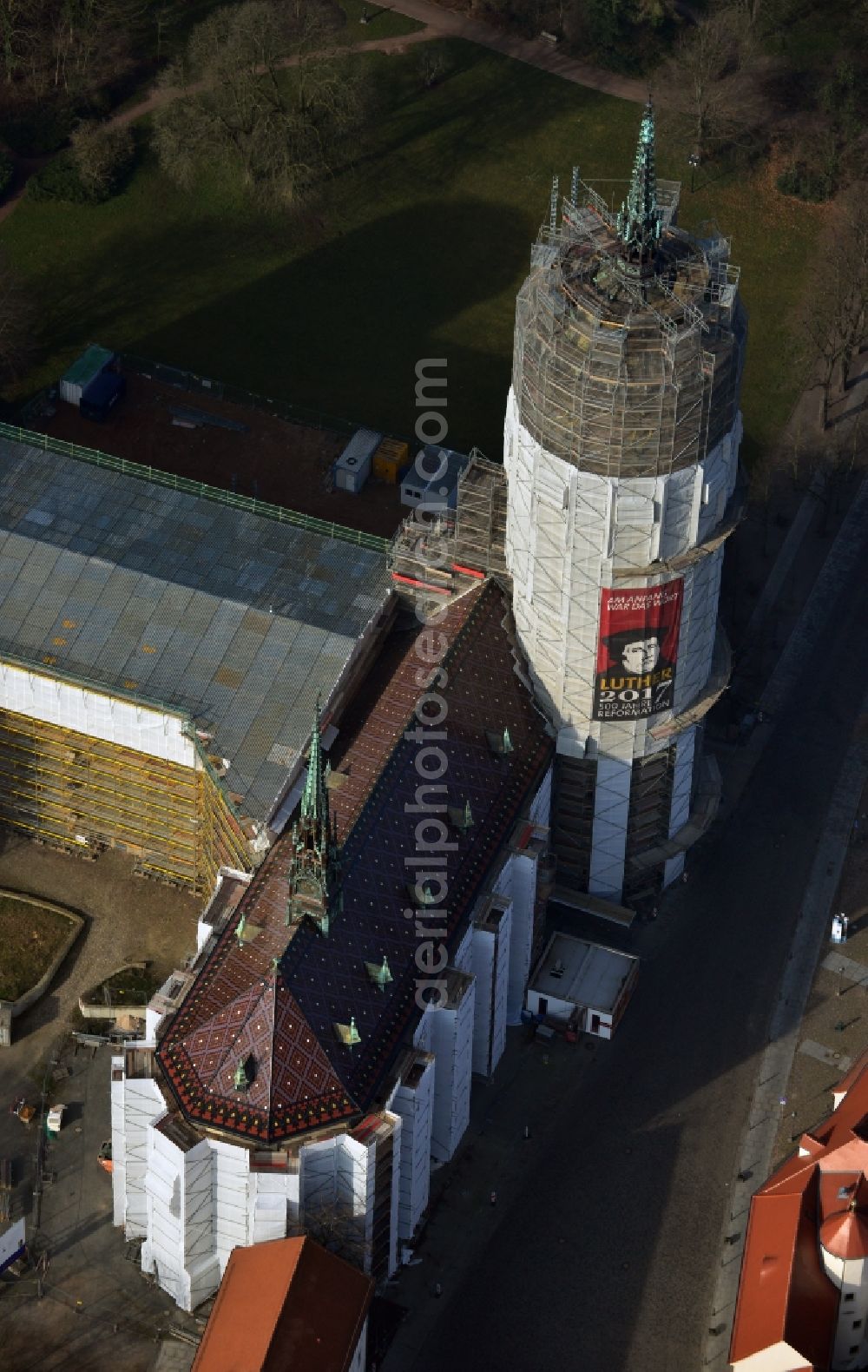 Aerial image Wittenberg - View of the castle church of Wittenberg. The castle with its 88 m high Gothic tower at the west end of the town is a UNESCO World Heritage Site. The first mention of the castle dates from 1187. It gained fame as in 1517 the Wittenberg Augustinian monk and theology professor Martin Luther spread his 95 disputation