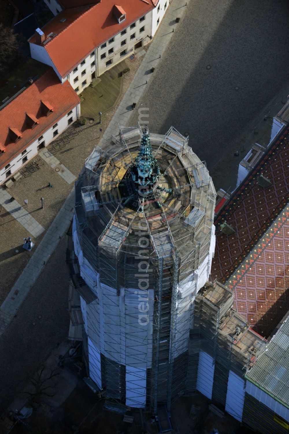 Aerial photograph Wittenberg - View of the castle church of Wittenberg. The castle with its 88 m high Gothic tower at the west end of the town is a UNESCO World Heritage Site. The first mention of the castle dates from 1187. It gained fame as in 1517 the Wittenberg Augustinian monk and theology professor Martin Luther spread his 95 disputation