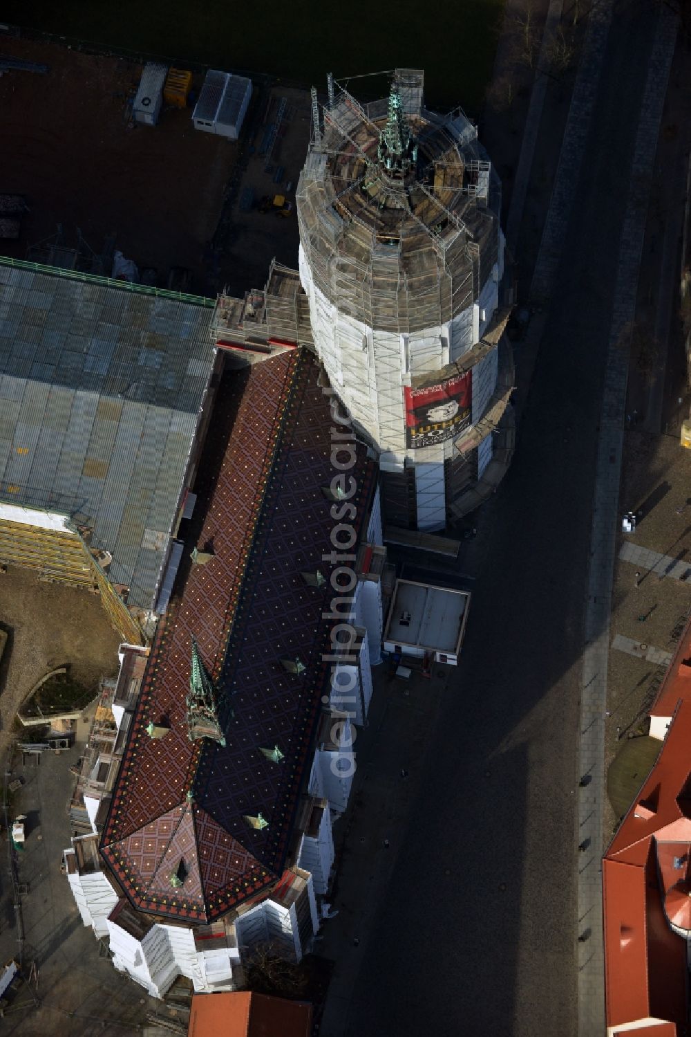 Aerial image Wittenberg - View of the castle church of Wittenberg. The castle with its 88 m high Gothic tower at the west end of the town is a UNESCO World Heritage Site. The first mention of the castle dates from 1187. It gained fame as in 1517 the Wittenberg Augustinian monk and theology professor Martin Luther spread his 95 disputation