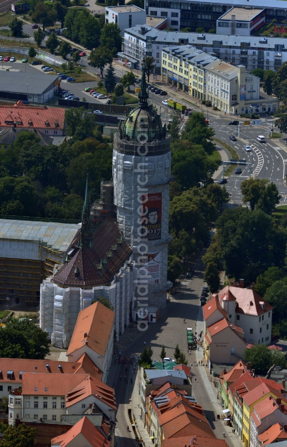 Aerial image Wittenberg - View of the castle church of Wittenberg. The castle with its 88 m high Gothic tower at the west end of the town is a UNESCO World Heritage Site. The first mention of the castle dates from 1187. It gained fame as in 1517 the Wittenberg Augustinian monk and theology professor Martin Luther spread his 95 disputation