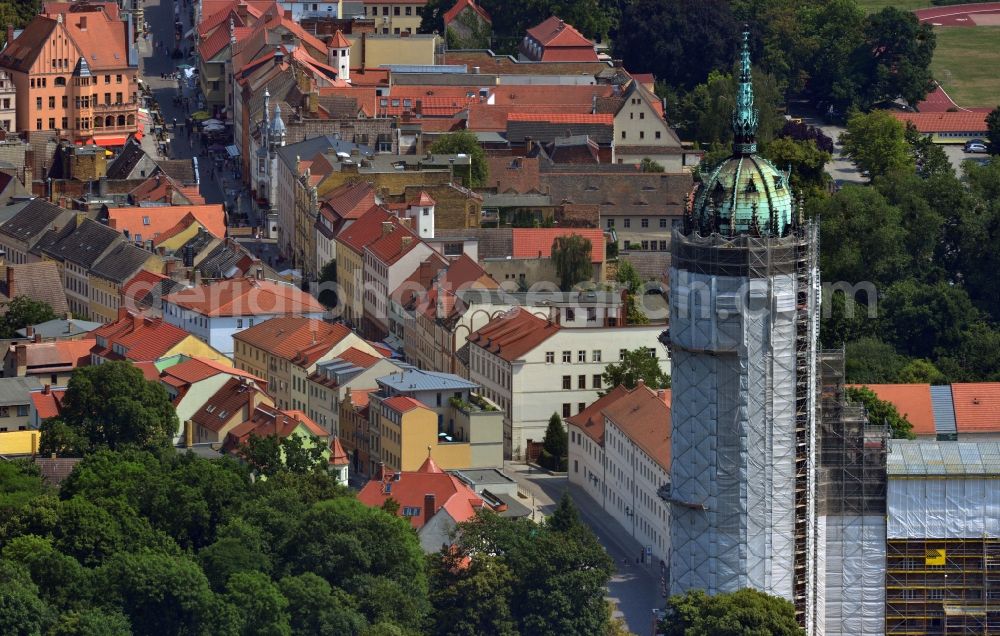 Aerial photograph Wittenberg - View of the castle church of Wittenberg. The castle with its 88 m high Gothic tower at the west end of the town is a UNESCO World Heritage Site. The first mention of the castle dates from 1187. It gained fame as in 1517 the Wittenberg Augustinian monk and theology professor Martin Luther spread his 95 disputation