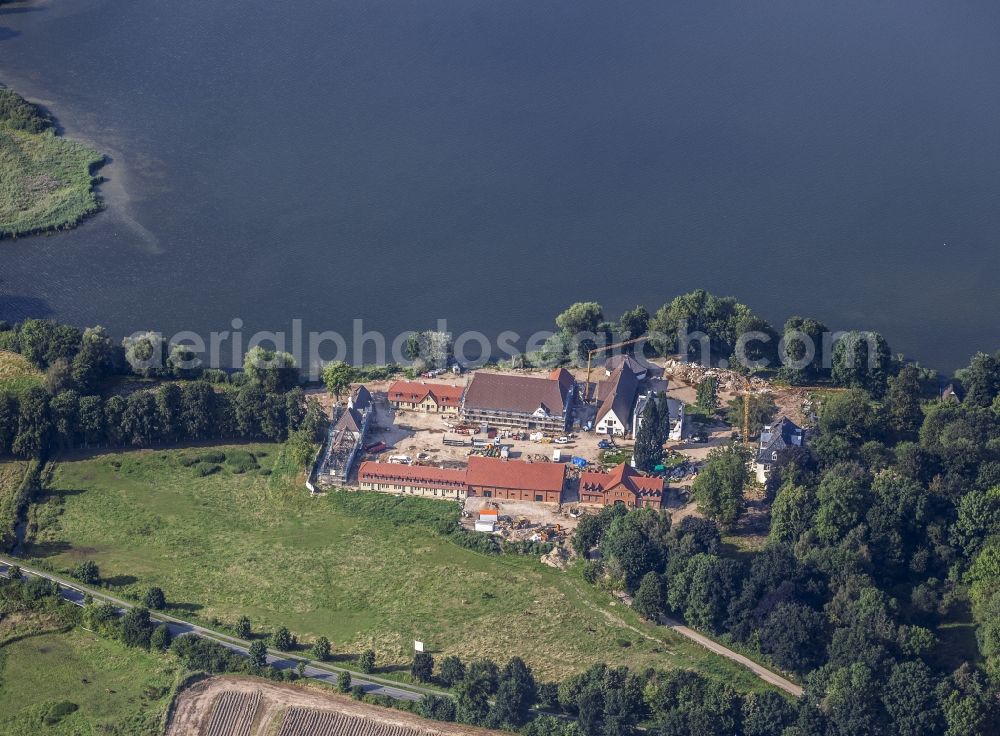 Aerial photograph Malente - Constuction site and renovation works on building and manor house of the farmhouse in Malente in the state Schleswig-Holstein, Germany