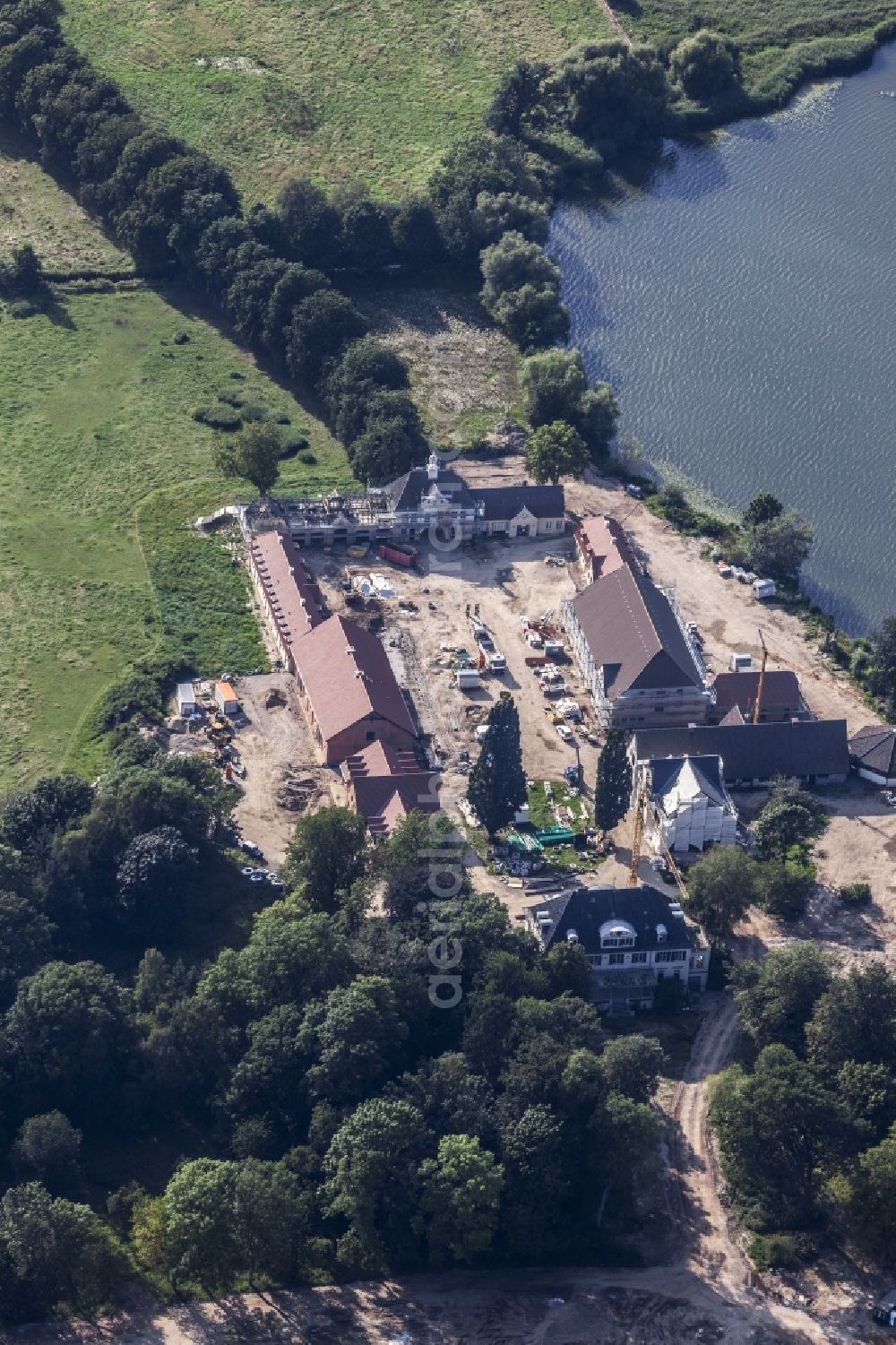 Aerial image Malente - Constuction site and renovation works on building and manor house of the farmhouse in Malente in the state Schleswig-Holstein, Germany