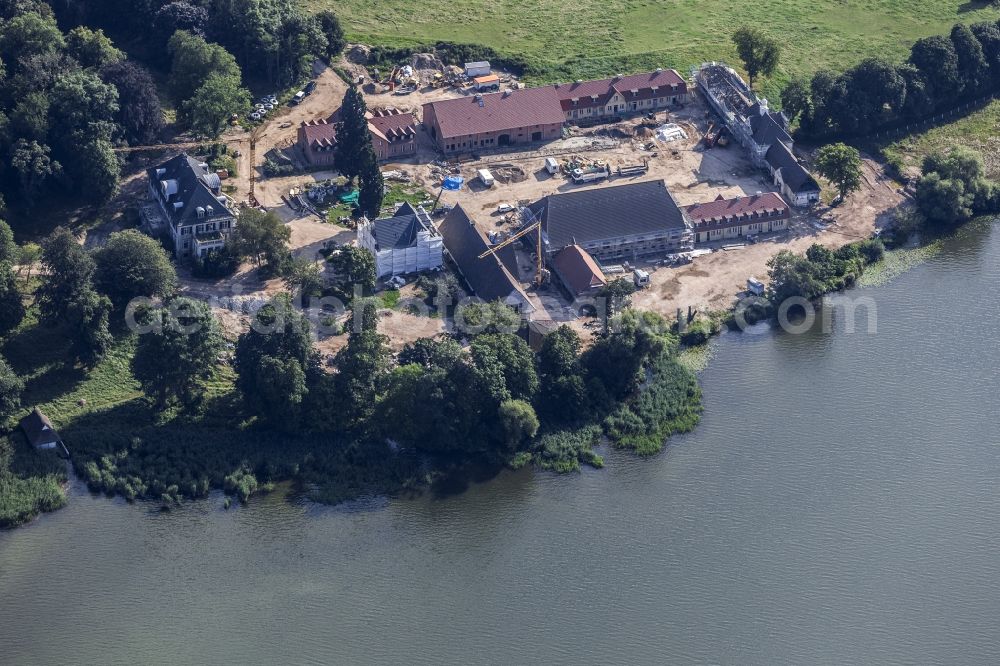 Aerial photograph Malente - Constuction site and renovation works on building and manor house of the farmhouse in Malente in the state Schleswig-Holstein, Germany