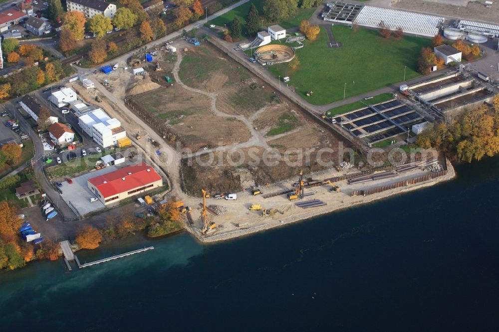 Grenzach-Wyhlen from above - Remediation at the site of the former wastewater treatment plant of the pharmaceutical company Roche in Grenzach-Wyhlen in Baden -Wuerttemberg. Construction of a temporary landing stage on the river Rhine for the removal of the excavated material