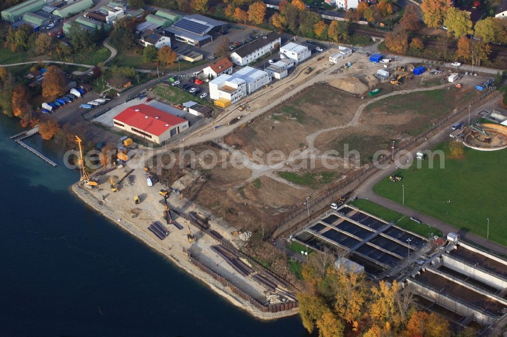 Grenzach-Wyhlen from the bird's eye view: Remediation at the site of the former wastewater treatment plant of the pharmaceutical company Roche in Grenzach-Wyhlen in Baden -Wuerttemberg. Construction of a temporary landing stage on the river Rhine for the removal of the excavated material