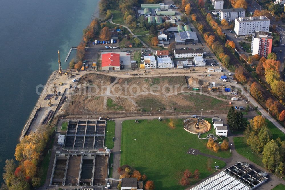 Aerial photograph Grenzach-Wyhlen - Remediation at the site of the former wastewater treatment plant of the pharmaceutical company Roche in Grenzach-Wyhlen in Baden -Wuerttemberg. Construction of a temporary landing stage on the river Rhine for the removal of the excavated material