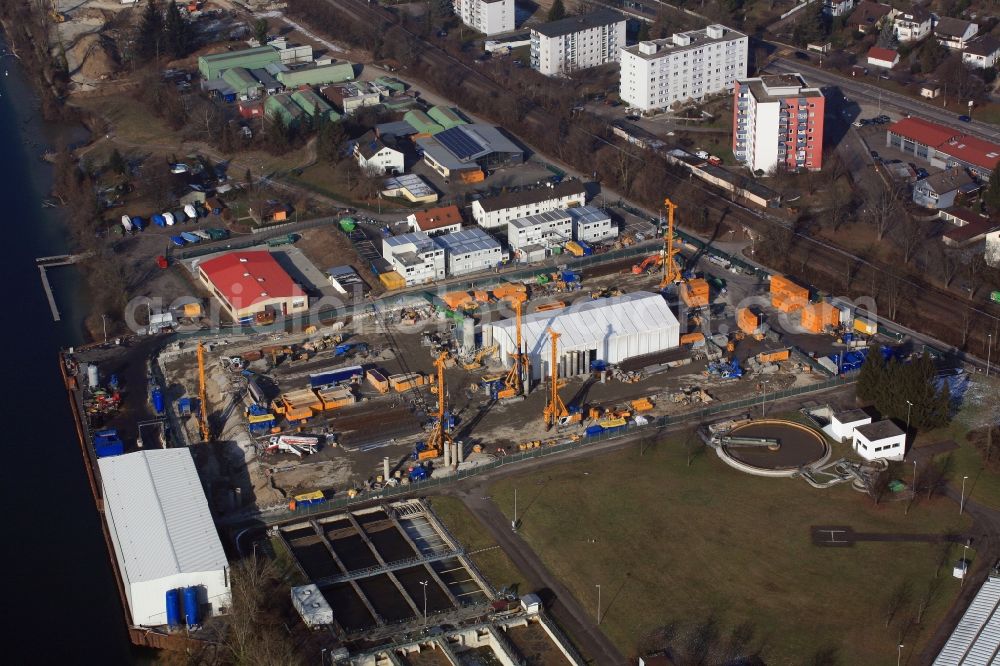 Grenzach-Wyhlen from the bird's eye view: Remediation at the site of the former wastewater treatment plant of the pharmaceutical company Roche in Grenzach-Wyhlen in Baden -Wuerttemberg. The temporary landing stage on the river Rhine is used for the removal of the excavated material