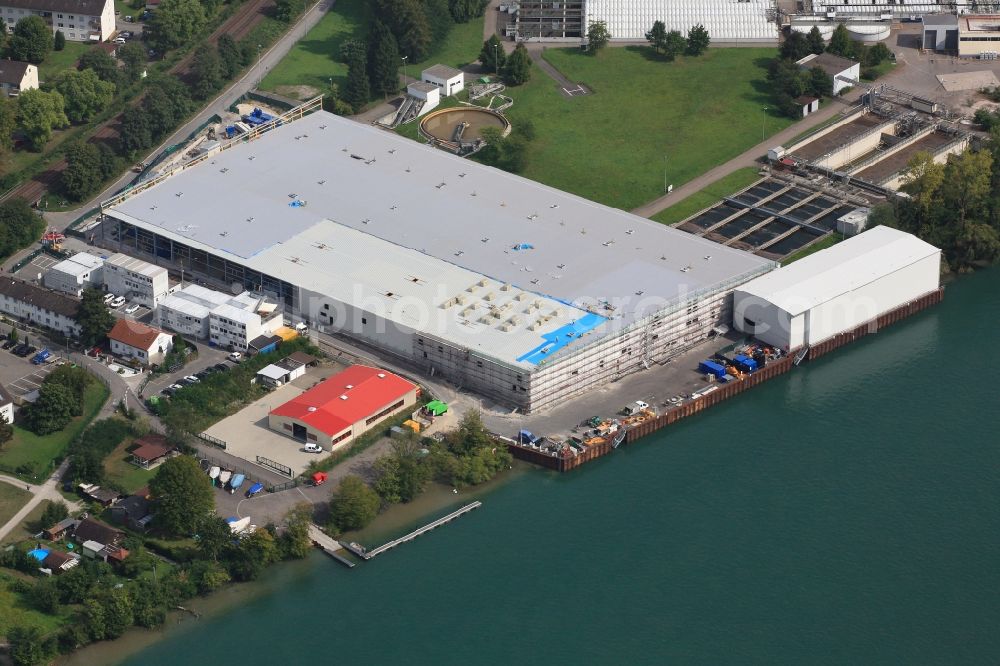 Aerial photograph Grenzach-Wyhlen - Remediation at the site of the former wastewater treatment plant of the pharmaceutical company Roche in Grenzach-Wyhlen in Baden -Wuerttemberg. The temporary landing stage on the river Rhine is used for the removal of the excavated material