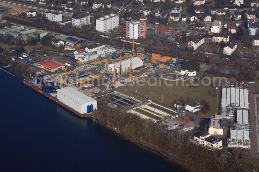 Aerial photograph Grenzach-Wyhlen - Remediation at the site of the former wastewater treatment plant of the pharmaceutical company Roche and BASF in Grenzach-Wyhlen in Baden -Wuerttemberg. The temporary landing stage on the river Rhine is used for the removal of the excavated material