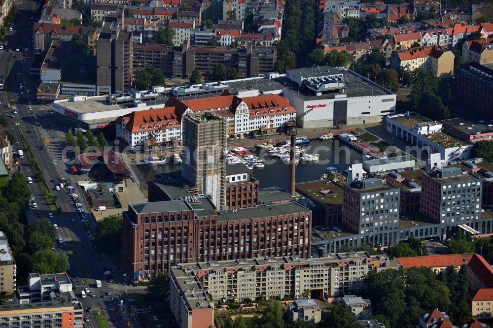 Berlin Tempelhof from above - Renovation work on the scaffolded clock tower of the Ullstein House of Becker & Kries group at Tempelhof harbor in Berlin