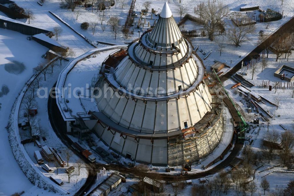 Aerial photograph Magdeburg - Restoration work on the wintry snowy wood Millennium Tower in Elbauenpark in Magdeburg in Saxony-Anhalt