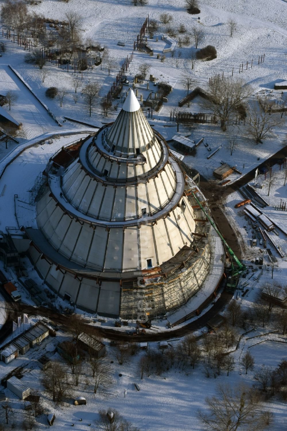 Magdeburg from the bird's eye view: Restoration work on the wintry snowy wood Millennium Tower in Elbauenpark in Magdeburg in Saxony-Anhalt