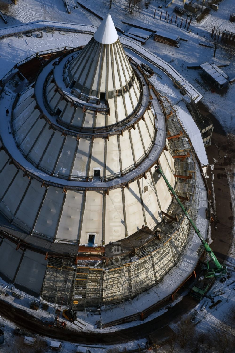 Aerial image Magdeburg - Restoration work on the wintry snowy wood Millennium Tower in Elbauenpark in Magdeburg in Saxony-Anhalt