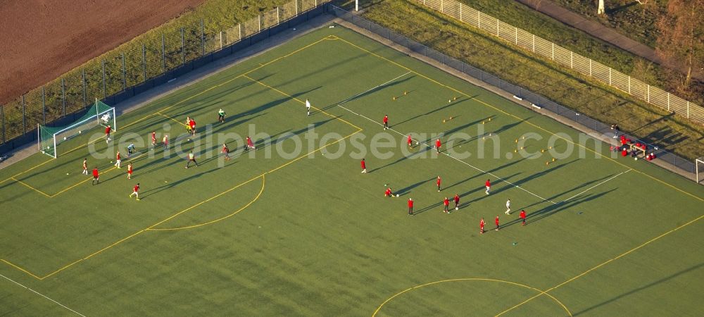 Hamm from the bird's eye view: Shadow play at soccer practice on the sports field of HSV in Hamm in North Rhine-Westphalia