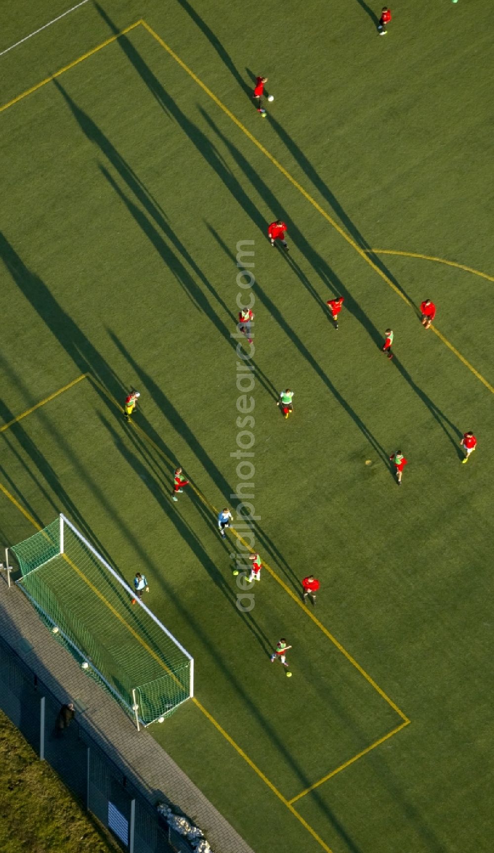 Hamm from the bird's eye view: Shadow play at soccer practice on the sports field of HSV in Hamm in North Rhine-Westphalia