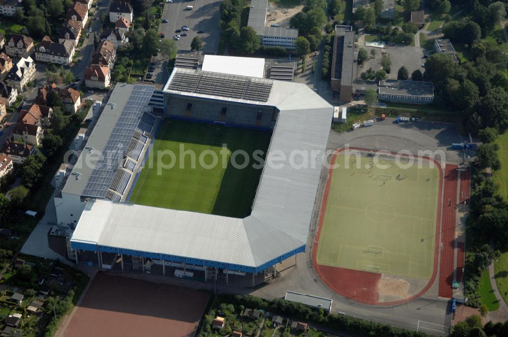 Aerial photograph Bielefeld - Die Schüco Arena, auch Bielefelder Alm oder Alm-Stadion genannt, im Grundbuch eingetragen als Stadion an der Melanchthonstraße, ist die Wettkampfstätte des Deutschen Sportclubs Arminia Bielefeld. Das Stadion an der Melanchthonstraße, dessen Namensrechte am 13. Januar 2004 an die Firma Schüco International KG vergeben wurden, bietet 27.300 Zuschauern Platz und ist im Besitz des Vereins, der es ohne öffentliche Zuschüsse betreibt. Kontakt DSC Arminia Bielefeld GmbH & Co. KGaA: Tel. +49(0)521 966 110, Email: kontakt@arminia-bielefeld.de; Kontakt Schüco International KG: Tel. +49(0)521 7830, Email: info@schueco.com