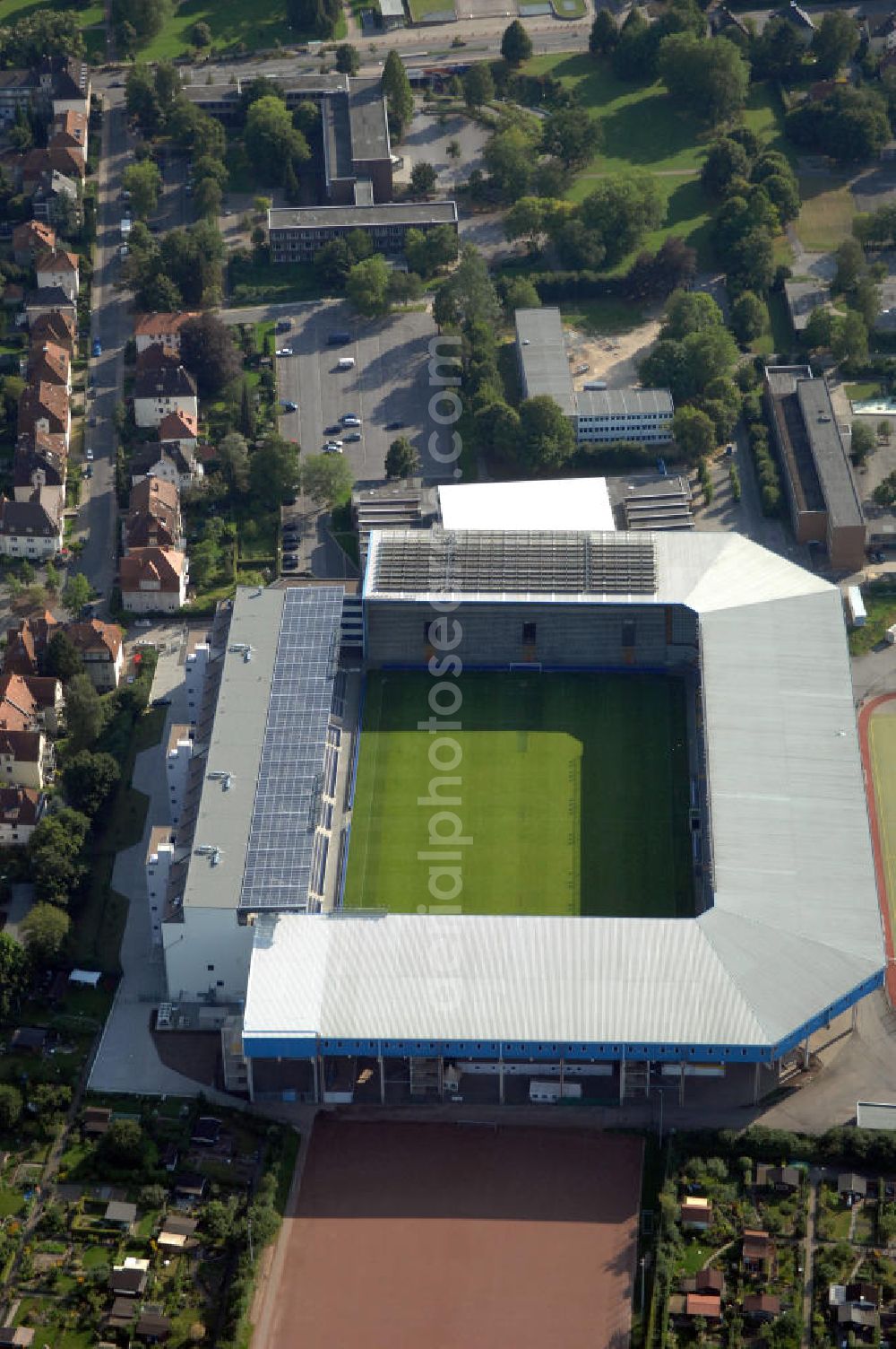 Aerial image Bielefeld - Die Schüco Arena, auch Bielefelder Alm oder Alm-Stadion genannt, im Grundbuch eingetragen als Stadion an der Melanchthonstraße, ist die Wettkampfstätte des Deutschen Sportclubs Arminia Bielefeld. Das Stadion an der Melanchthonstraße, dessen Namensrechte am 13. Januar 2004 an die Firma Schüco International KG vergeben wurden, bietet 27.300 Zuschauern Platz und ist im Besitz des Vereins, der es ohne öffentliche Zuschüsse betreibt. Kontakt DSC Arminia Bielefeld GmbH & Co. KGaA: Tel. +49(0)521 966 110, Email: kontakt@arminia-bielefeld.de; Kontakt Schüco International KG: Tel. +49(0)521 7830, Email: info@schueco.com