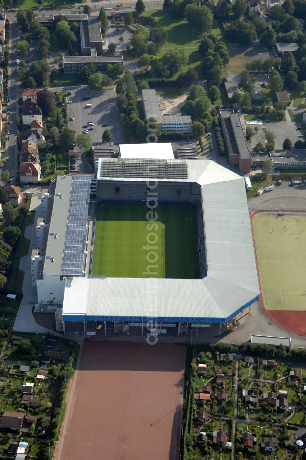 Aerial photograph Bielefeld - Die Schüco Arena, auch Bielefelder Alm oder Alm-Stadion genannt, im Grundbuch eingetragen als Stadion an der Melanchthonstraße, ist die Wettkampfstätte des Deutschen Sportclubs Arminia Bielefeld. Das Stadion an der Melanchthonstraße, dessen Namensrechte am 13. Januar 2004 an die Firma Schüco International KG vergeben wurden, bietet 27.300 Zuschauern Platz und ist im Besitz des Vereins, der es ohne öffentliche Zuschüsse betreibt. Kontakt DSC Arminia Bielefeld GmbH & Co. KGaA: Tel. +49(0)521 966 110, Email: kontakt@arminia-bielefeld.de; Kontakt Schüco International KG: Tel. +49(0)521 7830, Email: info@schueco.com