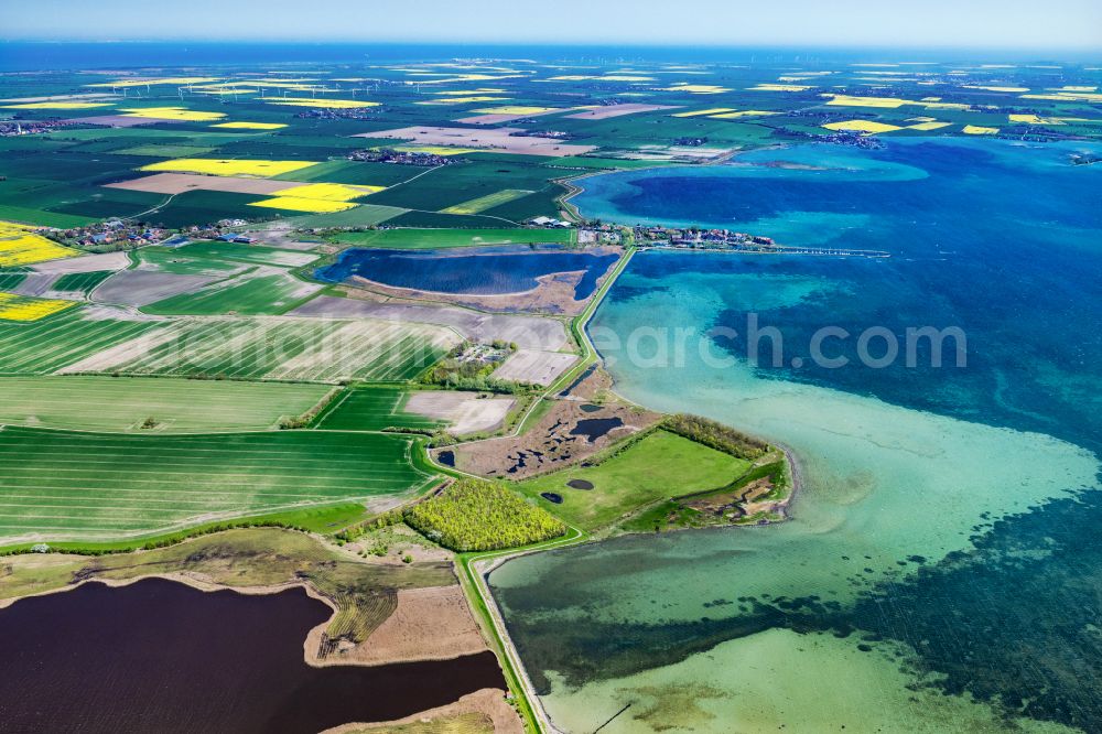 Fehmarn from the bird's eye view: Barn building on the edge of agricultural fields and farmland Orth in Fehmarn on the island of Fehmarn in the state Schleswig-Holstein, Germany