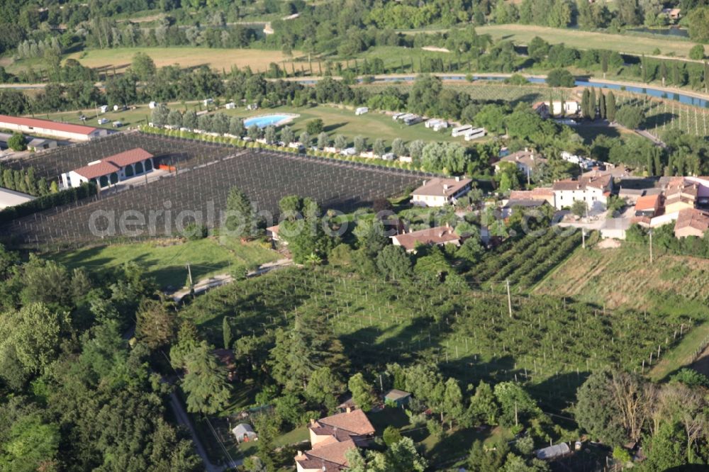 Valeggio sul Mincio from above - Barn building on the edge of agricultural fields and farmland in the district Monte Borghetto in Valeggio sul Mincio in Veneto, Italy