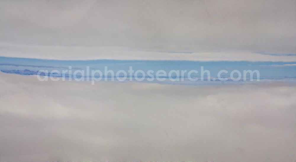 Aerial photograph Maribor - Sicht aus dem Cockpit eines Flugzeuges: Flug zwischen Schichtbewölkung durch Wolkenschichten wird der Blick auf das Alpenpanorama freigegeben.