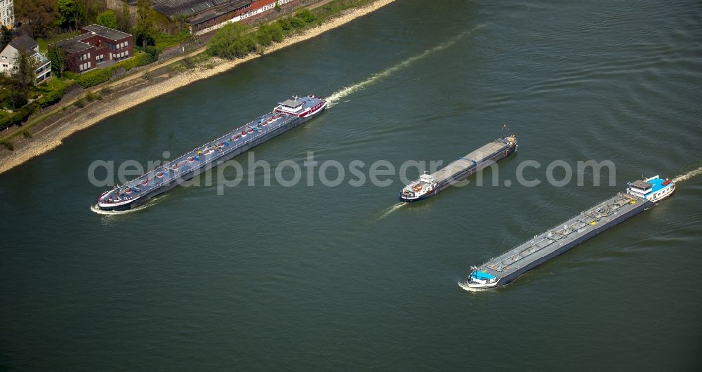 Aerial image Duisburg - Ships and barge trains inland waterway transport in driving on the waterway of the river rhine in Duisburg in the state North Rhine-Westphalia