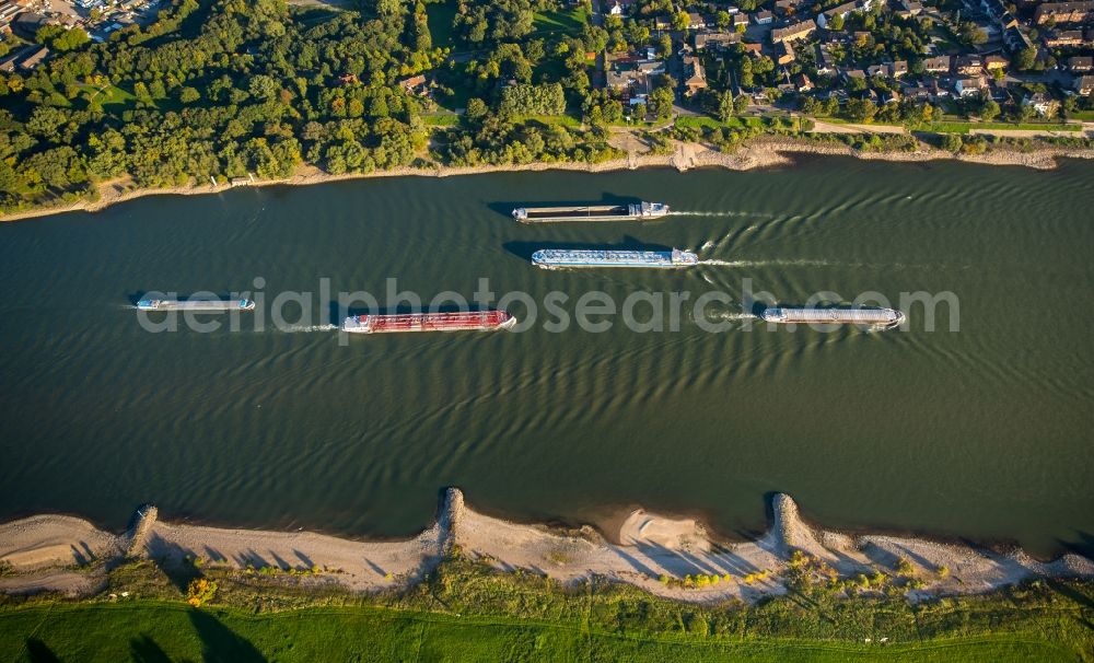 Aerial image Duisburg - Ships and barge trains inland waterway transport in driving on the waterway of the river of rhine in Duisburg in the state North Rhine-Westphalia