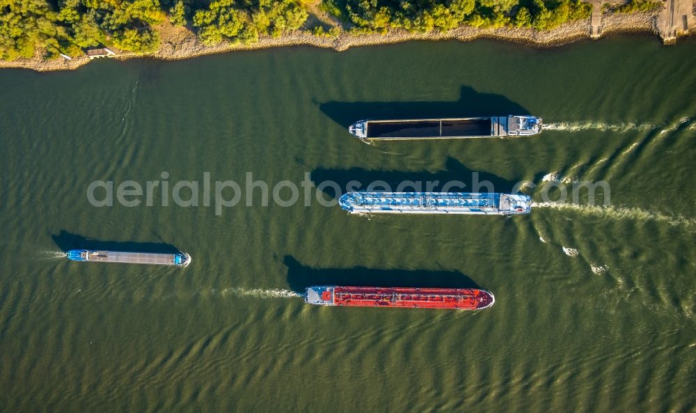 Aerial image Duisburg - Ships and barge trains inland waterway transport in driving on the waterway of the river of rhine in Duisburg in the state North Rhine-Westphalia