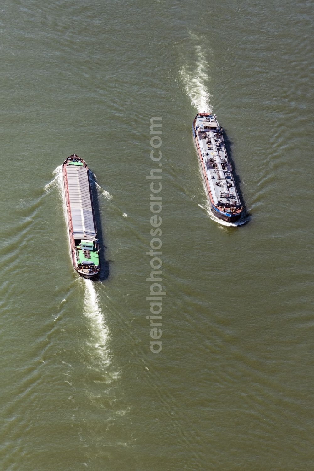 Aerial image Kestert - Ships and barge trains inland waterway transport in driving on the waterway of the river of the Rhine river in Kestert in the state Rhineland-Palatinate, Germany