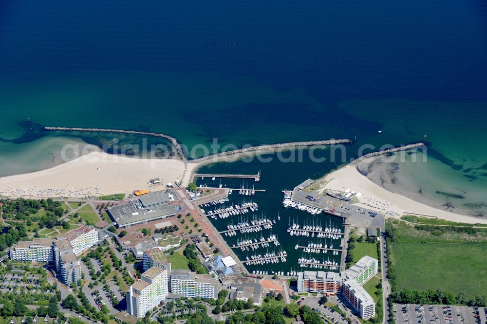 Damp from above - The local community Damp and its sailboats in the harbor besides the coastline of the baltic sea in the state Schleswig-Holstein