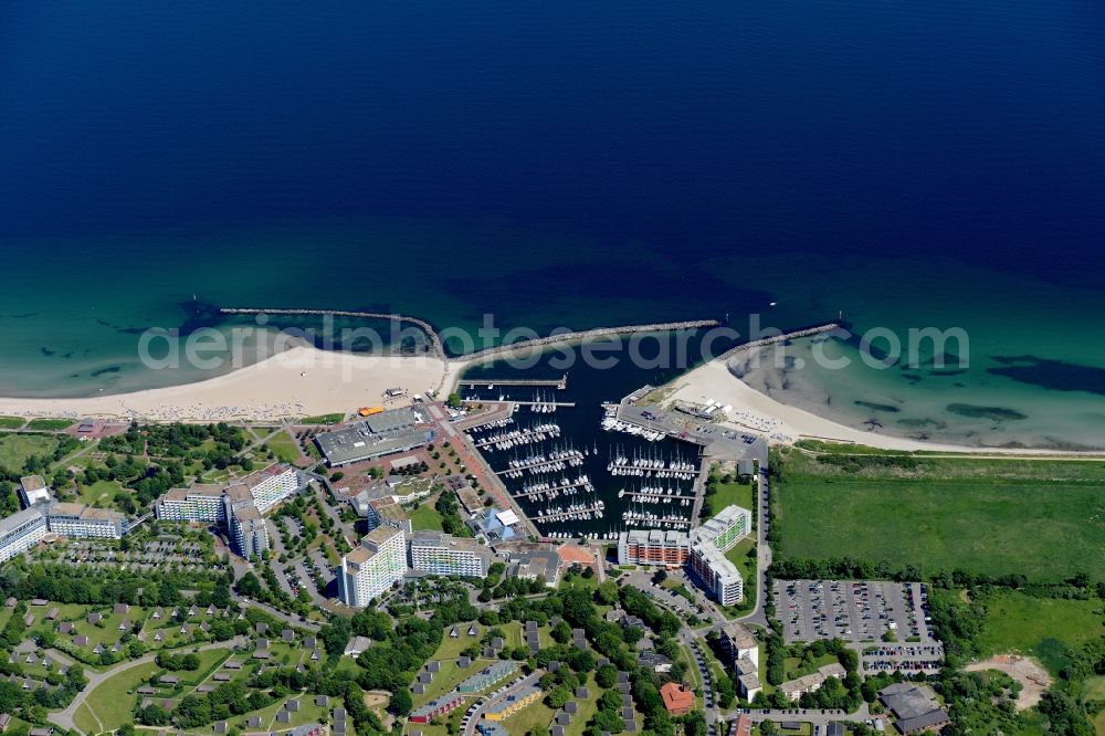 Damp from above - The local community Damp and its sailboats in the harbor besides the coastline of the baltic sea in the state Schleswig-Holstein