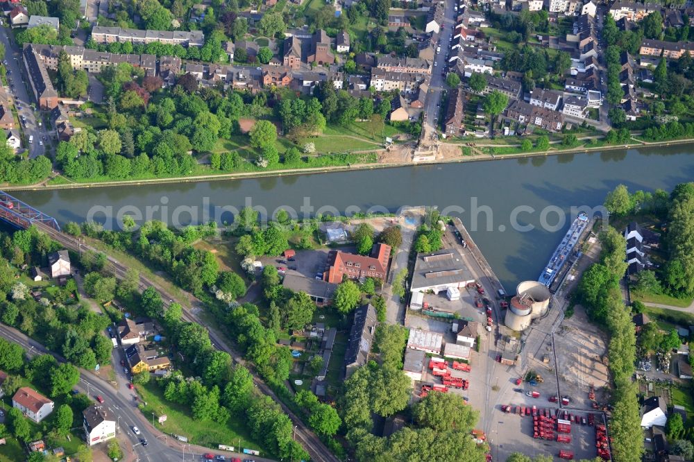 Duisburg from above - Ship docks with loading terminal at the oil port of the Rhine-Herne Canal at Duisburg in North Rhine-Westphalia. The site is the headquarters of Richard Buchen Umweltservice GmbH