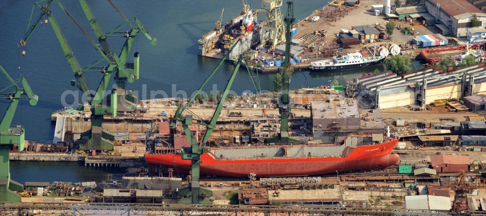 Danzig / Gdansk from the bird's eye view: Neubau vom Schiff Syn Antares im Trockendock der Werft Danzig AG im Hafen von Danzig-Schellmühl / Gdansk-Mlyniska in Pommern / Pomorskie, Polen. Newbuilding of the ship Syn Antares at a dry dock of the Gdansk shipyard at the port of Gdansk-Mlyniska in the Pomeranian Voivodeship / Pomorskie, Poland.