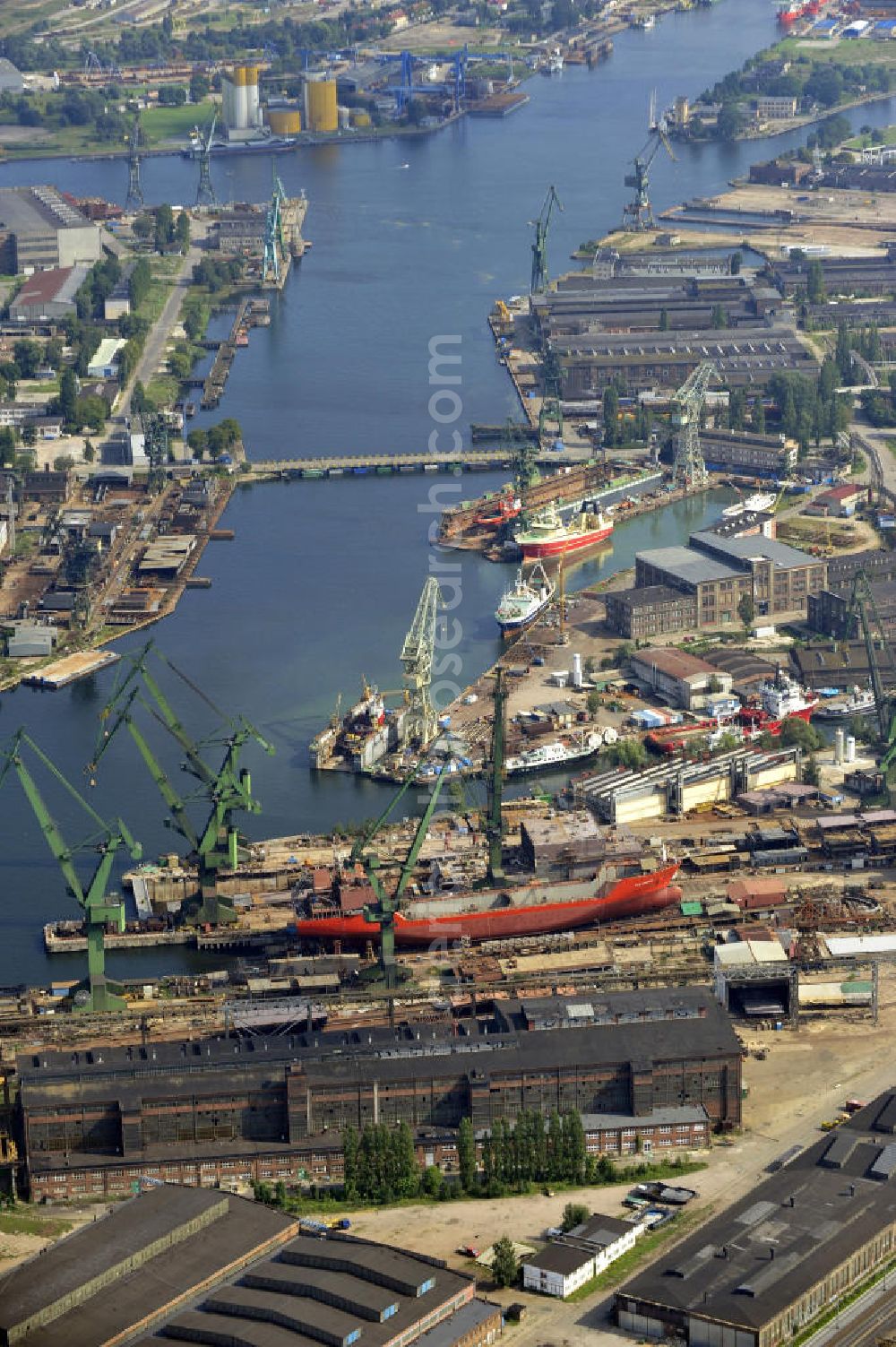 Aerial photograph Danzig / Gdansk - Neubau vom Schiff Syn Antares im Trockendock der Werft Danzig AG im Hafen von Danzig-Schellmühl / Gdansk-Mlyniska in Pommern / Pomorskie, Polen. Newbuilding of the ship Syn Antares at a dry dock of the Gdansk shipyard at the port of Gdansk-Mlyniska in the Pomeranian Voivodeship / Pomorskie, Poland.