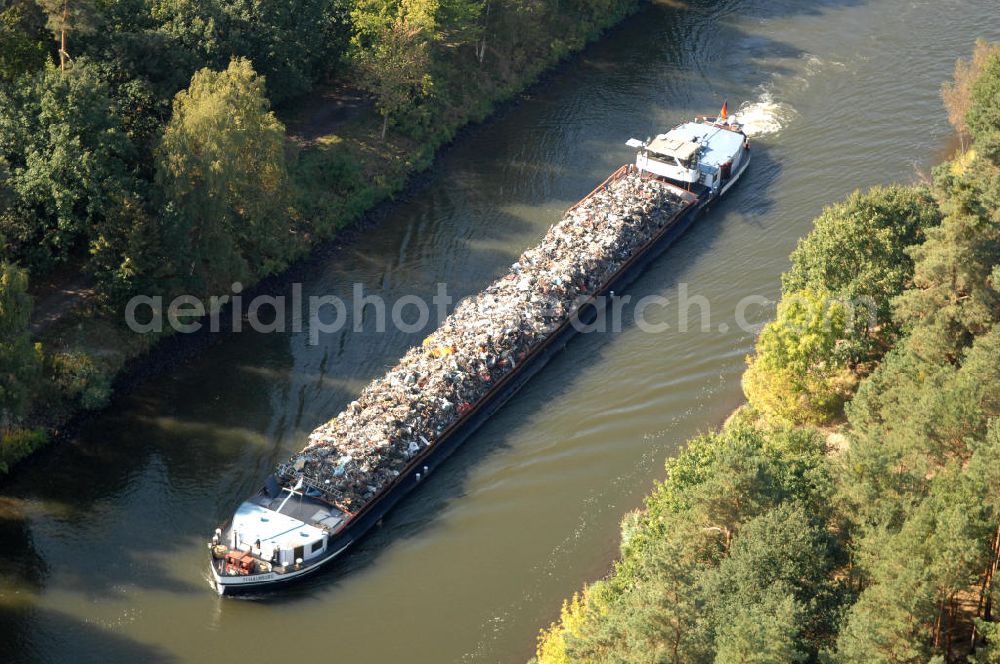 Aerial photograph Wusterwitz - Ein Schiff / Lastkahn, die Schaumburg, mit Schrott / Müll beladen fährt auf dem Elbe-Havel-Kanal bei Wusterwitz.