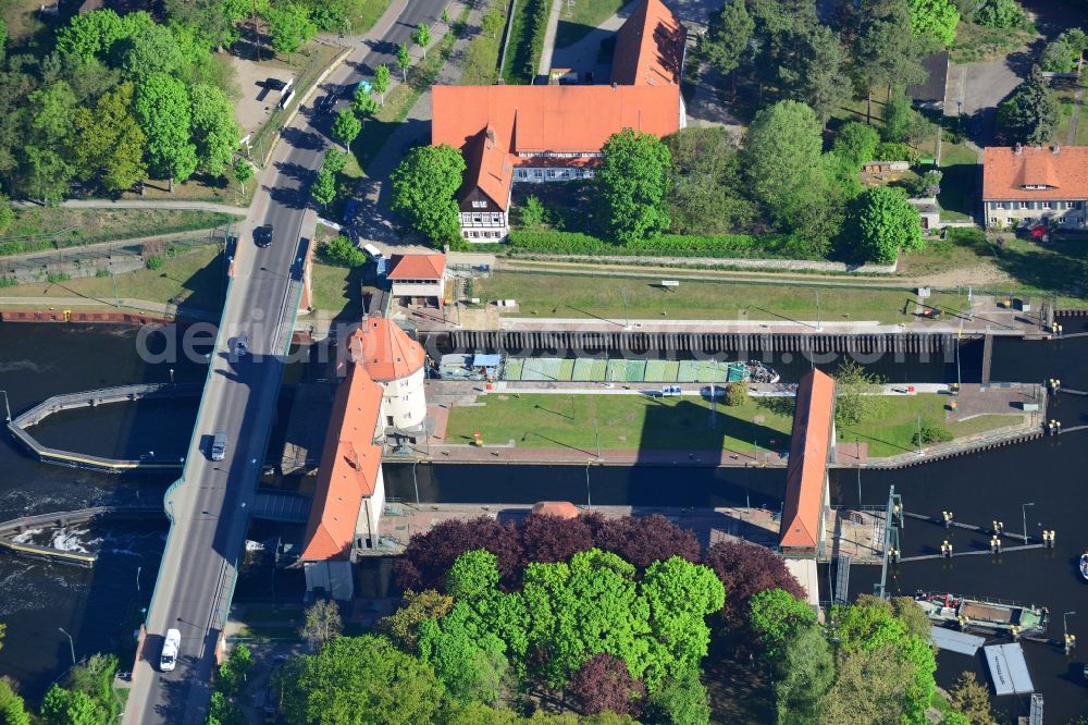 Kleinmachnow from above - Watergate Kleinmachnow in Kleinmachnow on the Teltow Canal in the state of Brandenburg. The facility is the most renowned building of the Teltow Canal. It is listed as a protected building. It was built in 1901 and is run by the Water and Ship Office of Berlin. The compound is located on Stahnsdorfer Damm and surrounded by forest