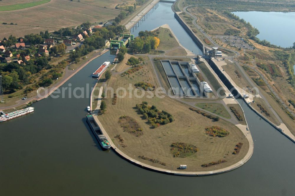 Rothensee from the bird's eye view: Die Sparschleuse Rothensee gehört zum Wasserstraßenkreuz Magdeburg, dass als Bestandteil der Verkehrsprojekte Deutsche Einheit Nr. 17 den Ausbau der Wasserstraßenverbindung Hannover- Magdeburg-Berlin beinhaltet. Die Schleuse Rothensee verbindet den Mittellandkanal mit den Magdeburger Häfen und der Elbe. Ein Projekt des WSV: Wasserstraßen-Neubauamt Magdeburg, 39106 Magdeburg, Tel. +49(0)391 535-0, email: wna-magdeburg@wsv.bund.de