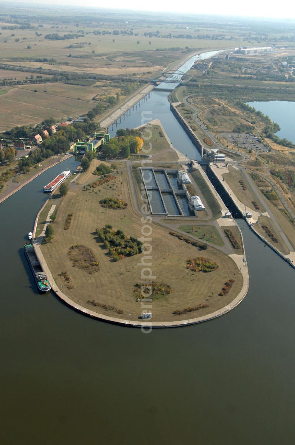 Aerial image Rothensee - Die Sparschleuse Rothensee gehört zum Wasserstraßenkreuz Magdeburg, dass als Bestandteil der Verkehrsprojekte Deutsche Einheit Nr. 17 den Ausbau der Wasserstraßenverbindung Hannover- Magdeburg-Berlin beinhaltet. Die Schleuse Rothensee verbindet den Mittellandkanal mit den Magdeburger Häfen und der Elbe. Ein Projekt des WSV: Wasserstraßen-Neubauamt Magdeburg, 39106 Magdeburg, Tel. +49(0)391 535-0, email: wna-magdeburg@wsv.bund.de