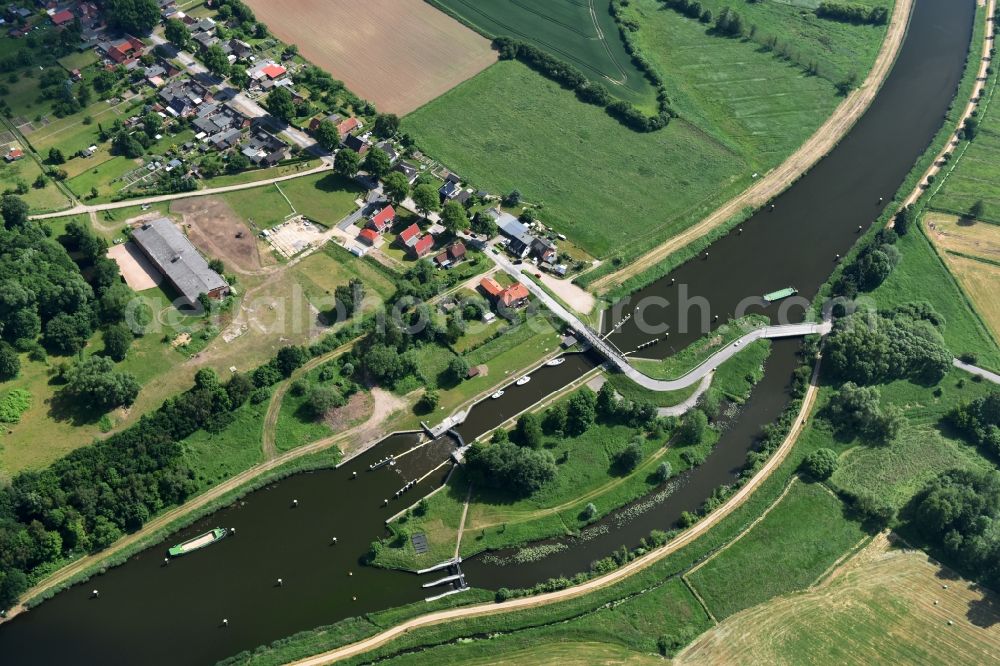 Aerial photograph Lübeck - Lock with sluice bridge Buessau at the riverside of the Elbe-Luebeck-Canal in Luebeck in the state Schleswig-Holstein