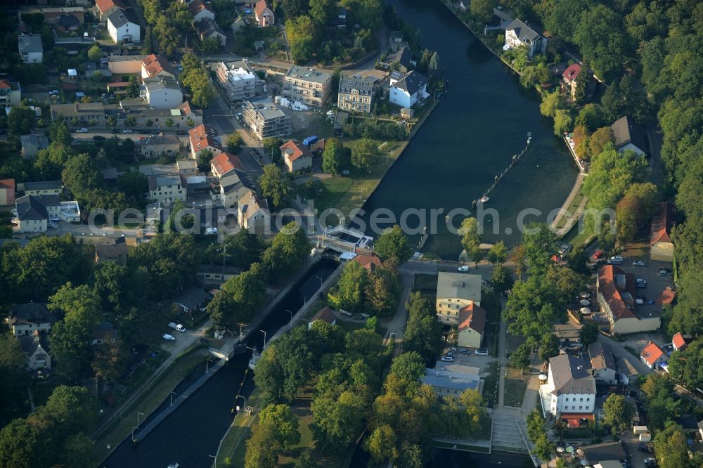 Woltersdorf from above - Watergate and lock of Woltersdorf in the state of Brandenburg. The watergate connects the rivers and waters of Ruedersdorf with the river Spree and is surrounded by forest and residential buildings