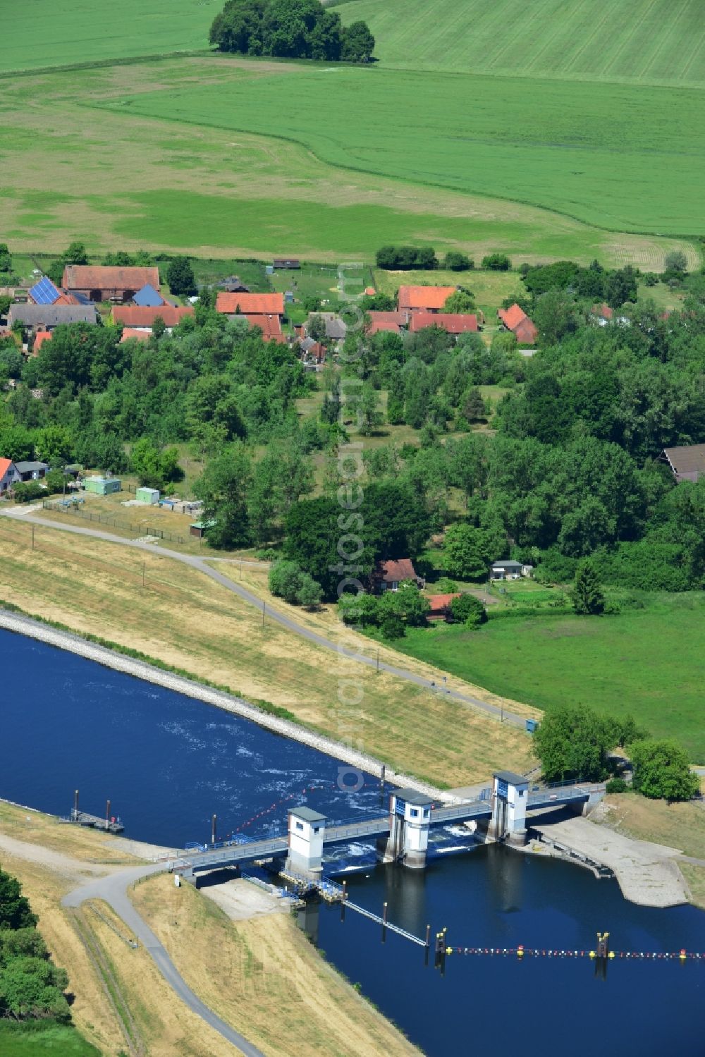 Gnevsdorf from above - Locks - plants on the banks of the waterway Gnevsdorfer Vorfluter in Gnevsdorf in the state Brandenburg