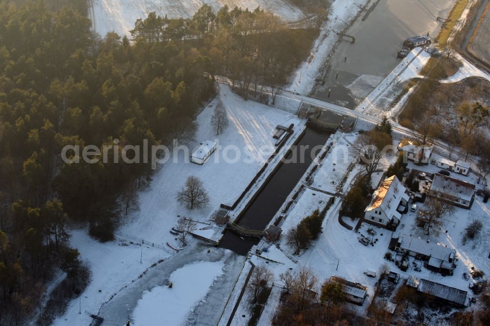 Aerial image Schönwalde-Glien - Locks - plants on the banks of the waterway of the winter covered with snow and ice Havelkanal in Schoenwalde-Glien in the state Brandenburg