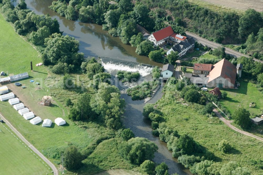 Aerial image Meddersheim - Schliffges Mill in the borough of Meddersheim in the state Rhineland-Palatinate. The borough and municipiality is a village in the county district of Bad Kreuznach. The mill is located on the river Nahe, with a tent camp in the South of it