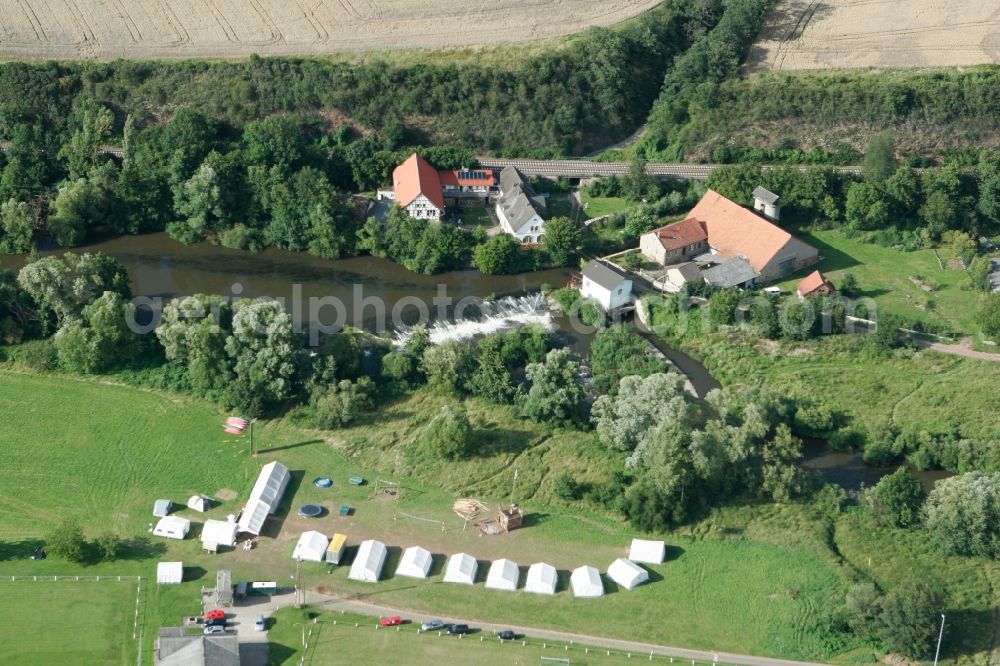 Meddersheim from above - Schliffges Mill in the borough of Meddersheim in the state Rhineland-Palatinate. The borough and municipiality is a village in the county district of Bad Kreuznach. The mill is located on the river Nahe, with a tent camp in the South of it