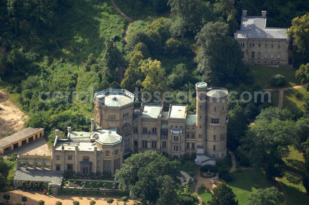 Potsdam from the bird's eye view: Blick auf das Schloss Babelsberg in Potsdam. Das im Stil der englischen Gotik gestaltete Gebäude wurde in den Jahren 1835-1849 im Park Babelsberg als Sommersitz für den späteren Kaiser Wilhelm I errichtet. Das Schloss liegt in der Hügellandschaft an der Havel, ist unter der Verwaltung der Stiftung Preußische Schlösser und Gärten Berlin-Brandenburg und steht als Weltkulturerbe unter dem Schutz der UNESCO;