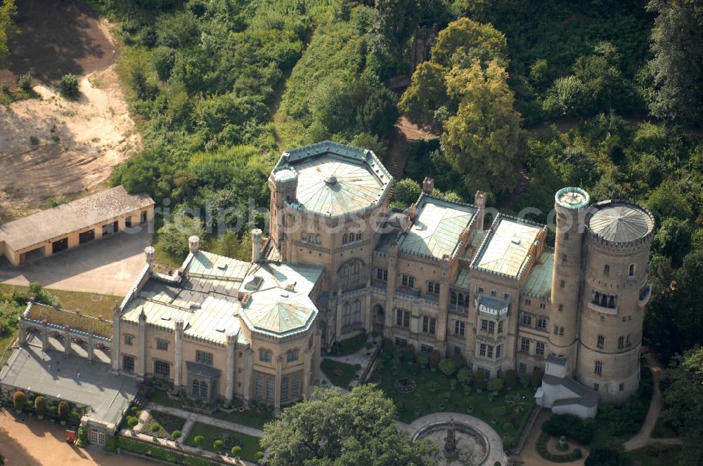 Aerial photograph Potsdam - Blick auf das Schloss Babelsberg in Potsdam. Das im Stil der englischen Gotik gestaltete Gebäude wurde in den Jahren 1835-1849 im Park Babelsberg als Sommersitz für den späteren Kaiser Wilhelm I errichtet. Das Schloss liegt in der Hügellandschaft an der Havel, ist unter der Verwaltung der Stiftung Preußische Schlösser und Gärten Berlin-Brandenburg und steht als Weltkulturerbe unter dem Schutz der UNESCO;