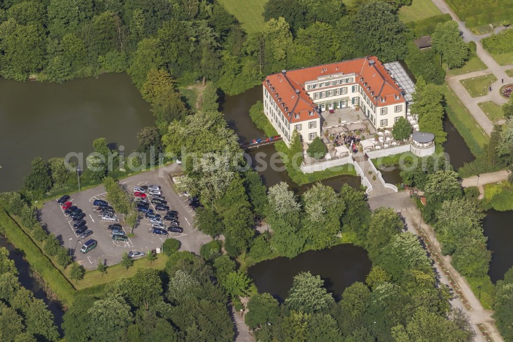 Aerial image Gelsenkirchen - 09/06/2012 GELSENKIRCHEN castle overlooking mountains in the Buer district of Gelsenkirchen, North Rhine-Westphalia. It was built as a fortress to protect the water today in Gelsenkirchen district alder and to 1433 was the family seat of the mountains. In the first half of the 16th Century, rebuilt into a castle and in the last quarter of the 18th Century changed again, to the mansion of the system presented in the style of late baroque to classicism at the threshold. It is now used as a hotel-restaurant