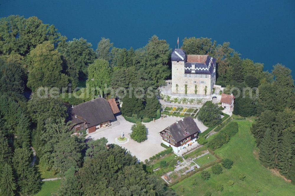 Buonas from the bird's eye view: Idyllic situated at Lake Zug is the Buonas Castle on the peninsula Buonas in Risch in Switzerland. The Buonas Castle, also known as Castle Hertenstein, serves as a training center for managment people of the pharmaceutical company Roche