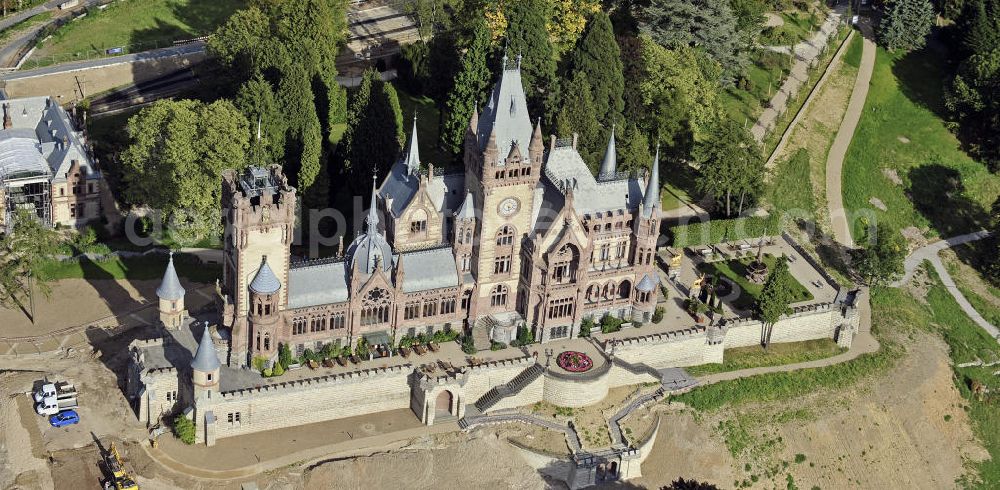 Königswinter from above - Blick auf das Schloss Drachenburg, ein schlossartiges Anwesen auf dem Drachenfels in Königswinter. Es wurde von 1882 bis 1884 als repräsentativer Wohnsitz gebaut. Seit 1986 steht das Schloss Drachenburg unter Denkmalschutz und wurde 1990 der Nordrhein-Westfalen-Stiftung unterstellt. View of the Castle Drachenburg, a castle-like estate on the Drachenfels in Konigswinter. It was built from 1882 to 1884 as a representative residence. Since 1986 the Castle Drachenburg is a listed building.